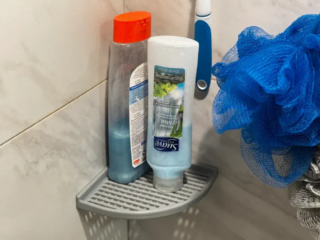 A large, matching shelf for shampoo bottles