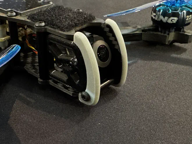 Thin, printed guards on either side of the camera